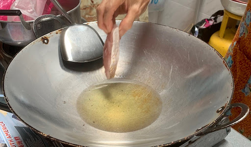 Put fish into hot oil